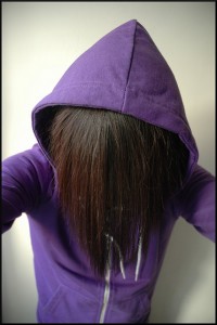 anonymous in a purple hoodie